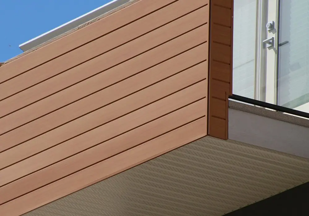 Corner overhang clad in AFX woodgrain aluminum panels