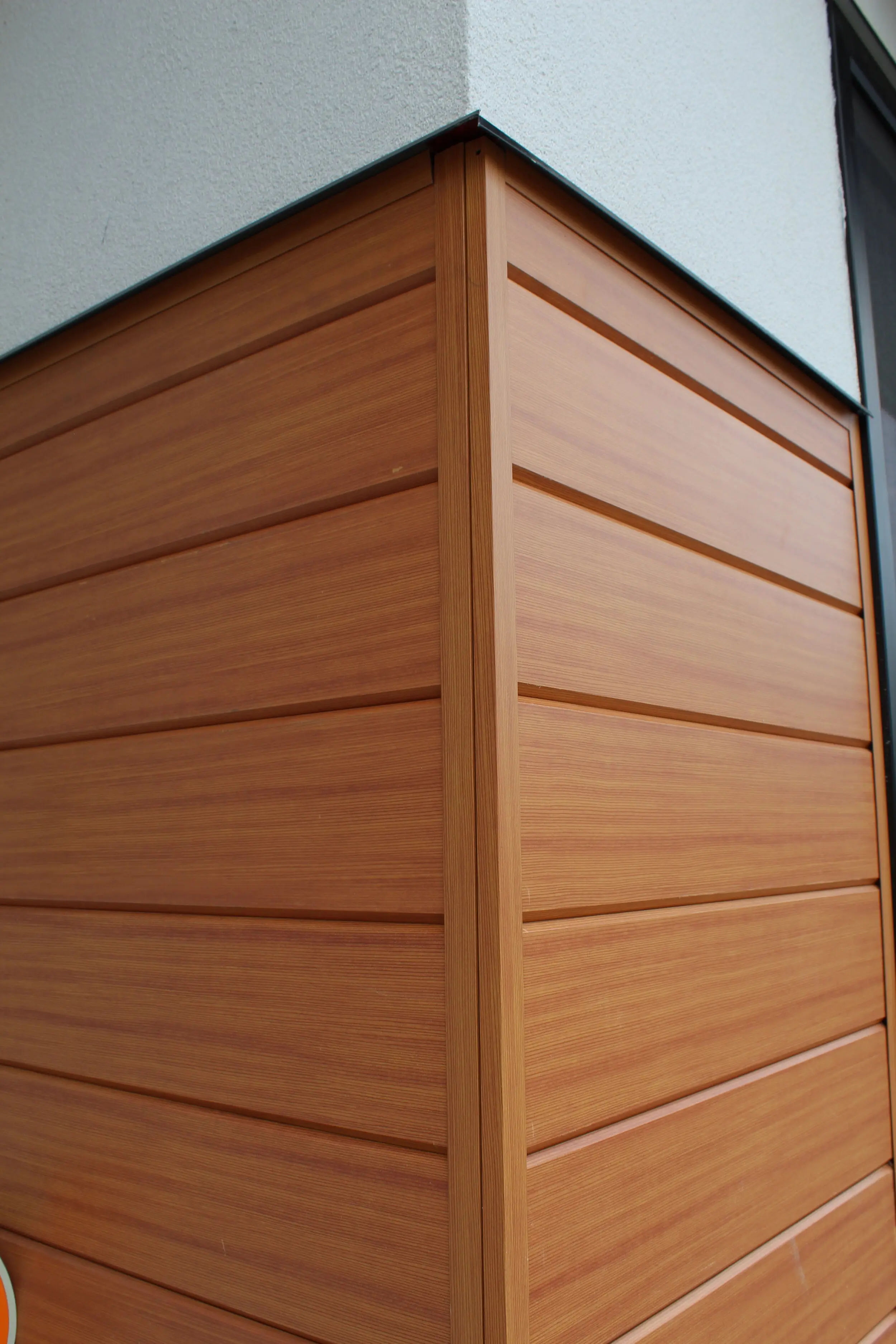 Outside corner finished with AFX woodgrain aluminum cladding